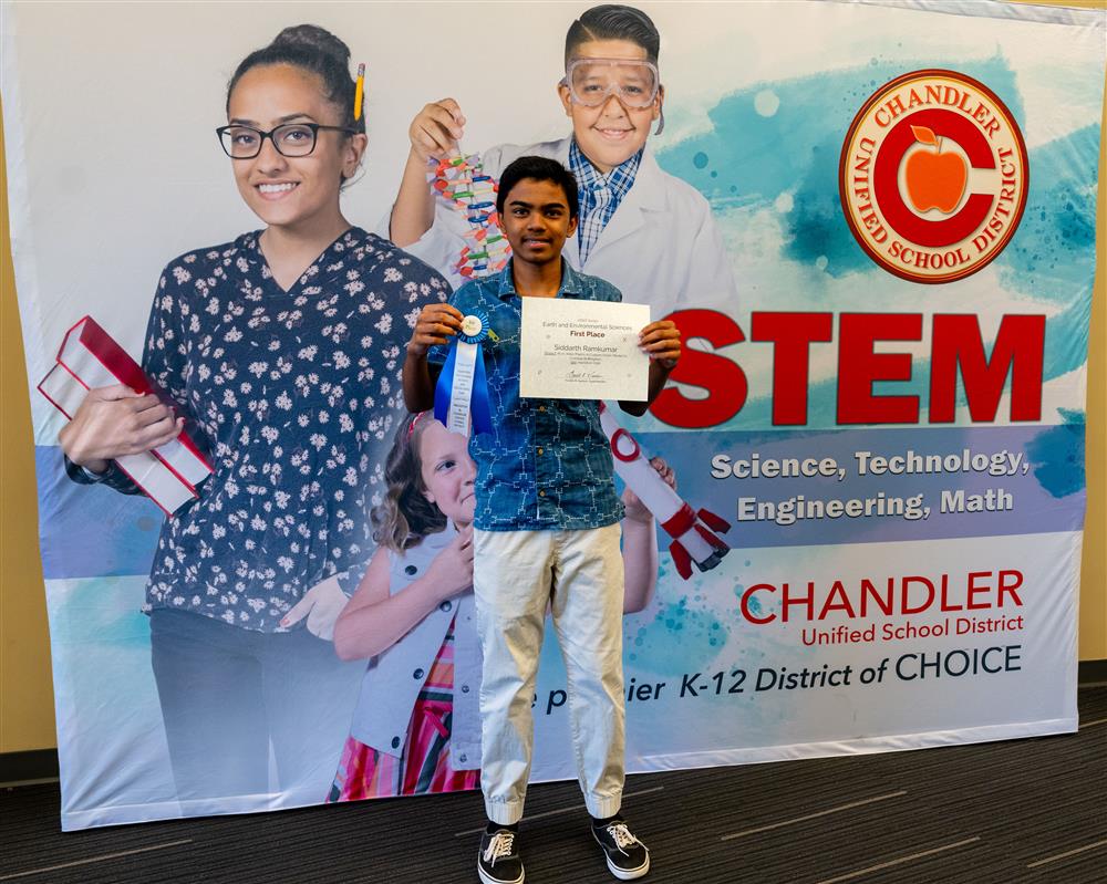 A student with his Science Fair award.